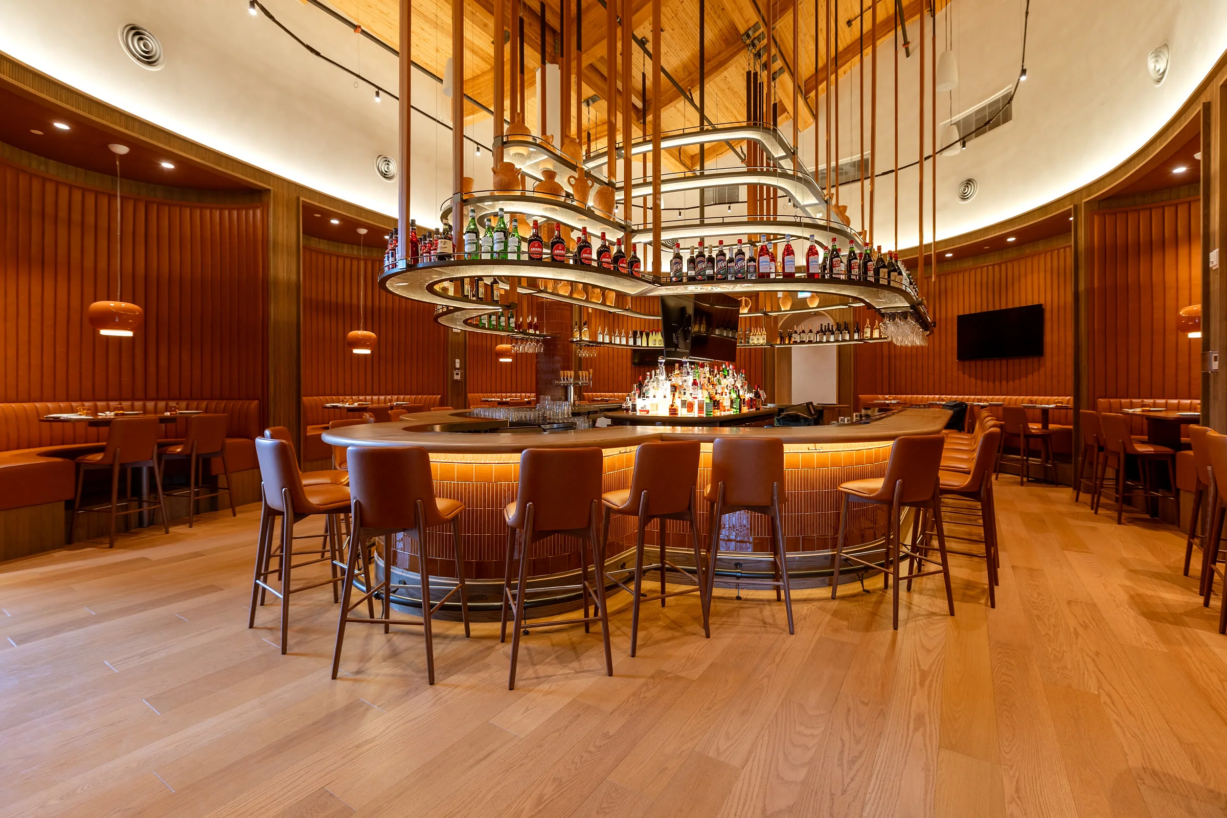 Custom wood millwork, casework, and curved bar at Mercatto Brightwater